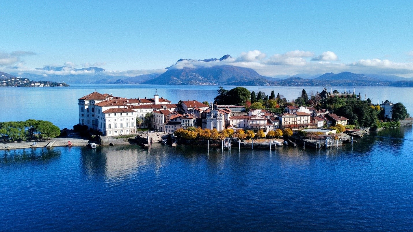 The resort and buildings of Stresa on Lake Maggiore with mountains in the distance. 